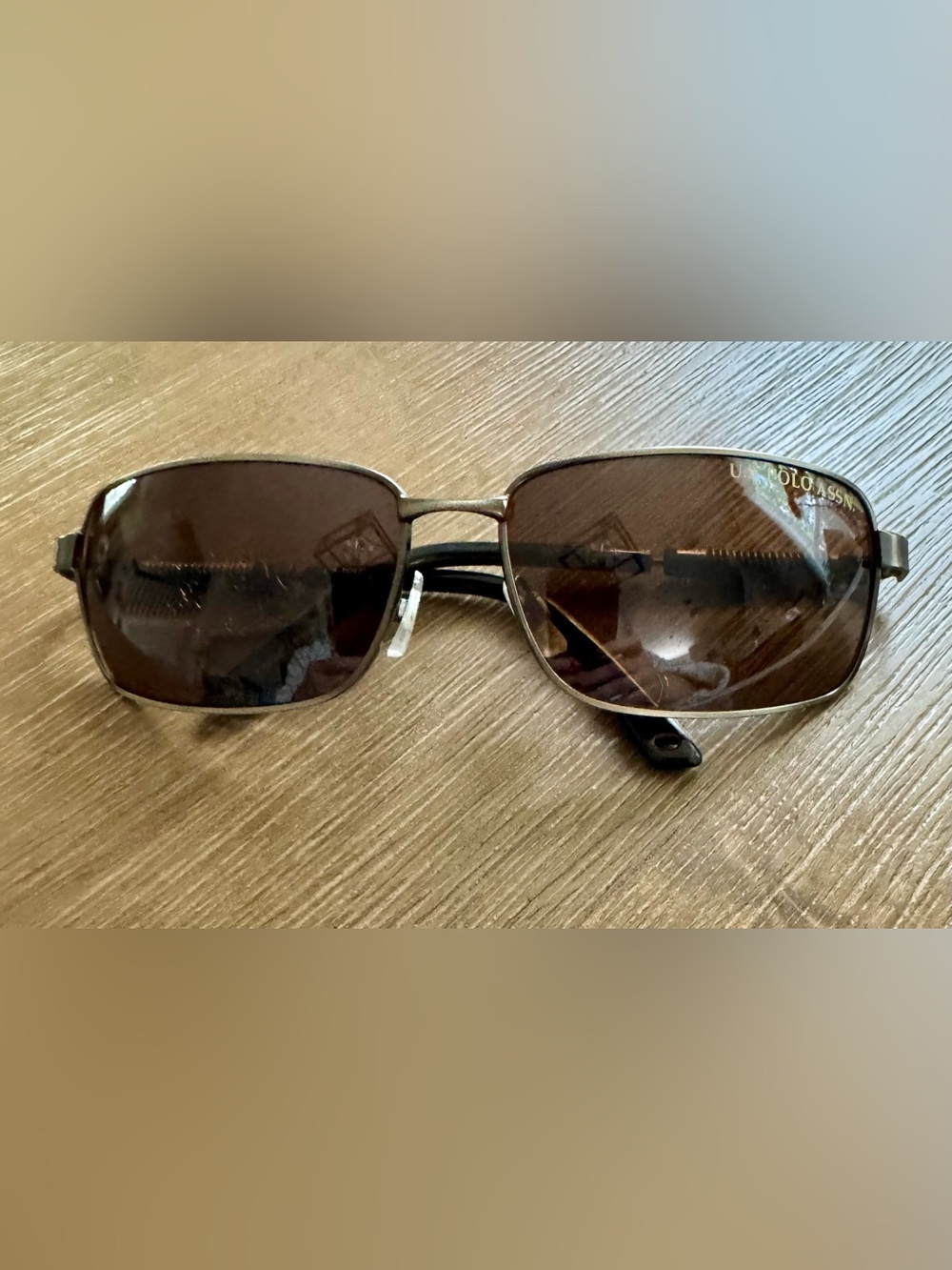 U.S. Polo Assn. Men's rectangular sunglasses featuring a metal frame. The brand